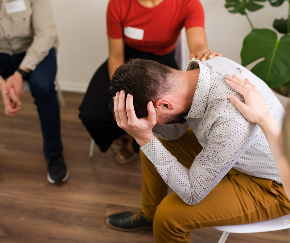 distraught young man at group therapy meeting in process of breaking free and recovering from tranq addiction